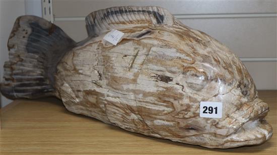 A South East Asian petrified wood carving of a fish length 63cm